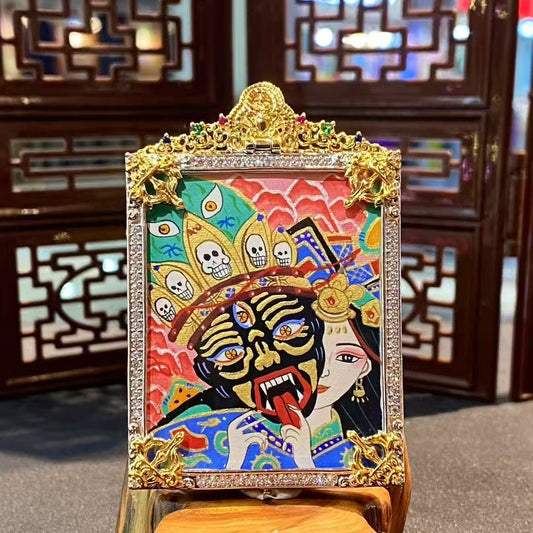 Front view of a hand-painted Zaki Lhamo thangka depicting the Tibetan female guardian deity, set in a gold-plated copper gau box