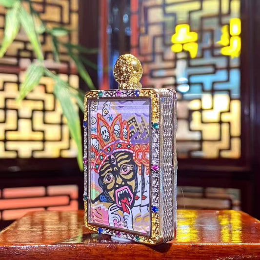 Side view of the Zaki Lhamo thangka pendant showing the thickness and metal craftsmanship of the copper gau box