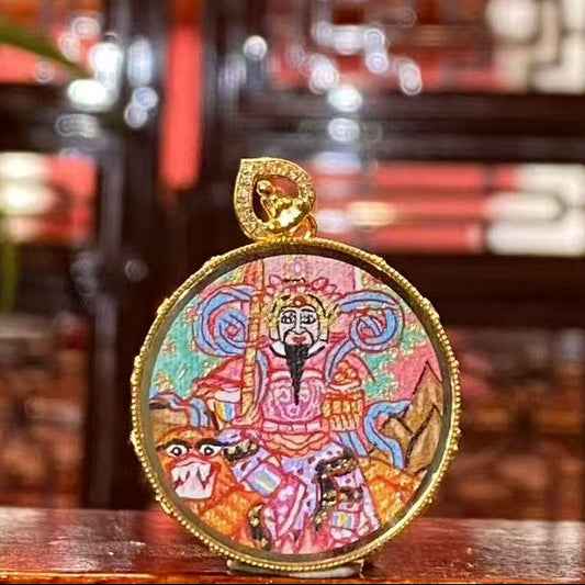 Front view of Zhao Gongming Taoist Thangka pendant, hand-painted in 18K gold with lotus symbolism, Rebgong craftsmanship in a Gawu box