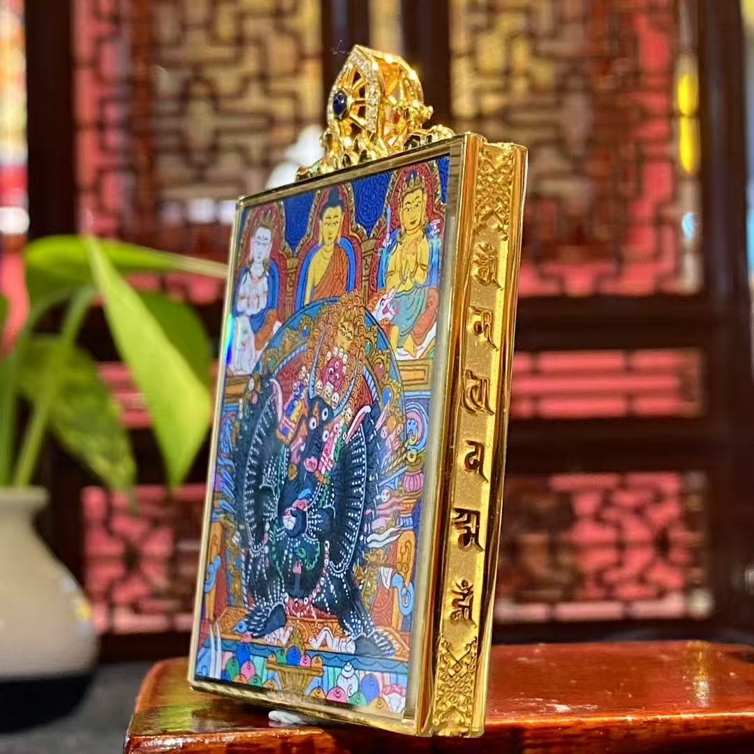 Side view of 18K gold Gau box thangka pendant showing sapphire crystal protection and Rebgong craftsmanship details
