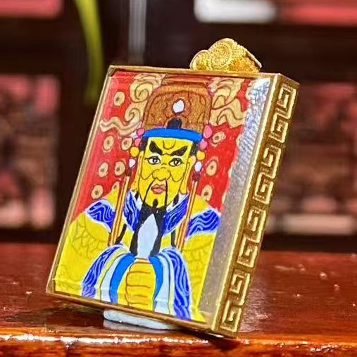 Side view of 18K gold gau box Tibetan thangka pendant with sapphire crystal lens, hand-painted Guangji Dragon King Bodhisattva artwork