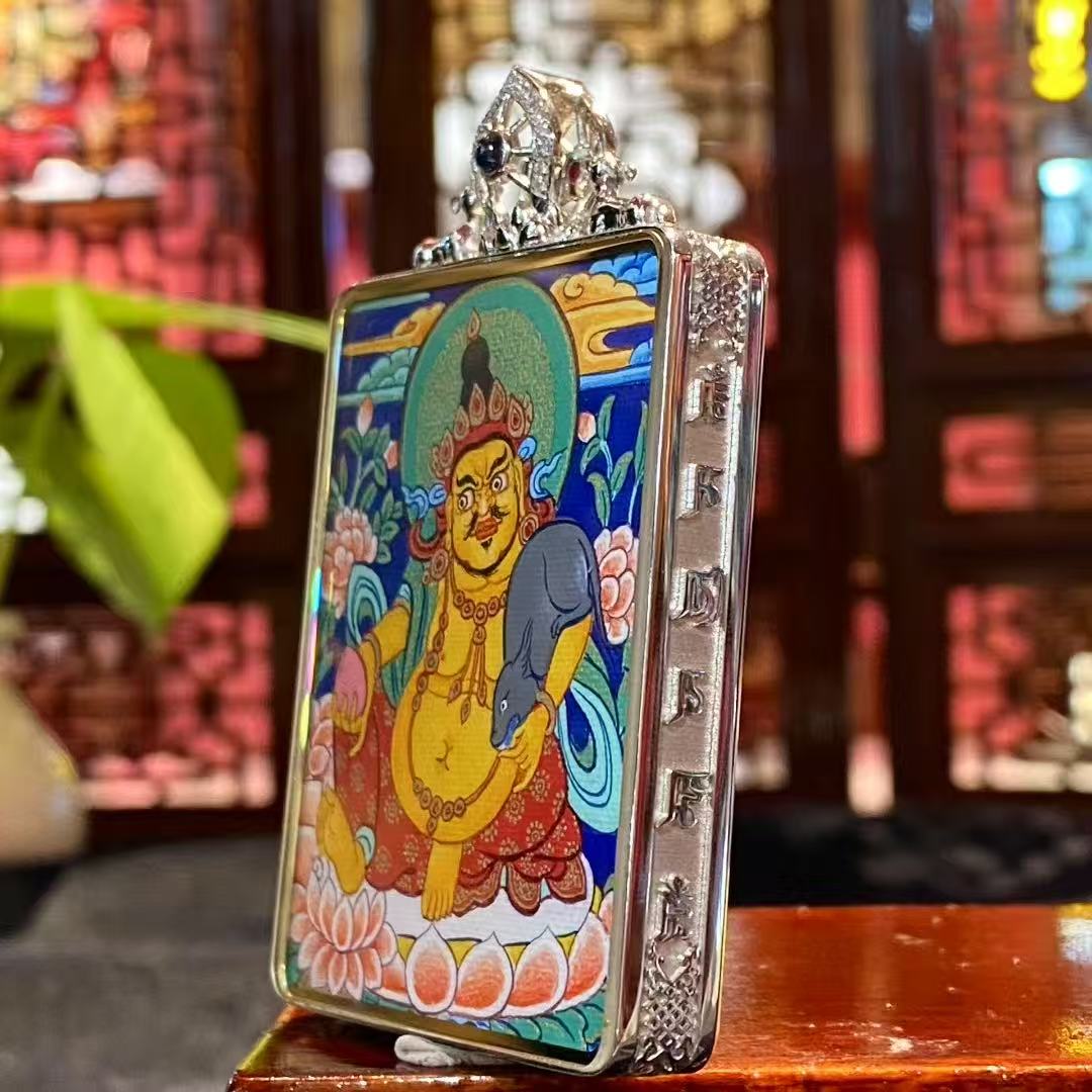 Detail of 18K gold Gau box with sapphire crystal mirror, showcasing craftsmanship of a double-sided Tibetan Gau Thangka pendant