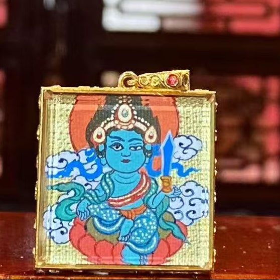 Back view of a double-sided hand-painted Gau Thangka pendant featuring Acala Vidyaraja, symbolizing immovable wisdom and fearless protection