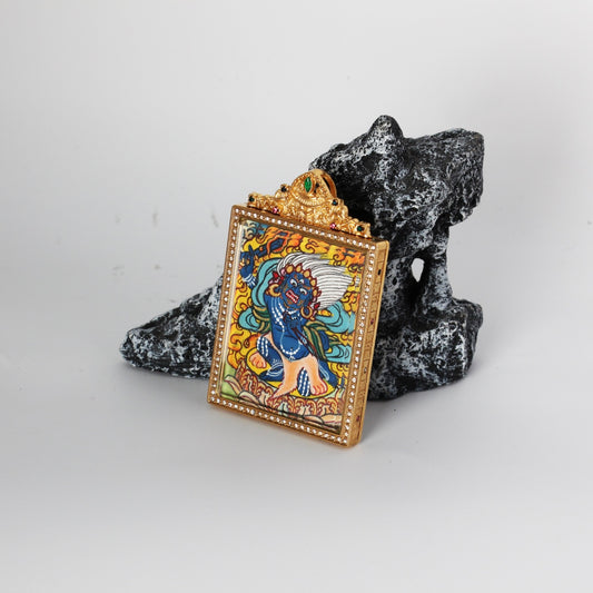 Front view of Acalanatha (Fudo Myo-o) mini thangka pendant highlighting the hand-painted deity image, crystal-set border around the frame, and the ornate crown top with green and multicolor stones.