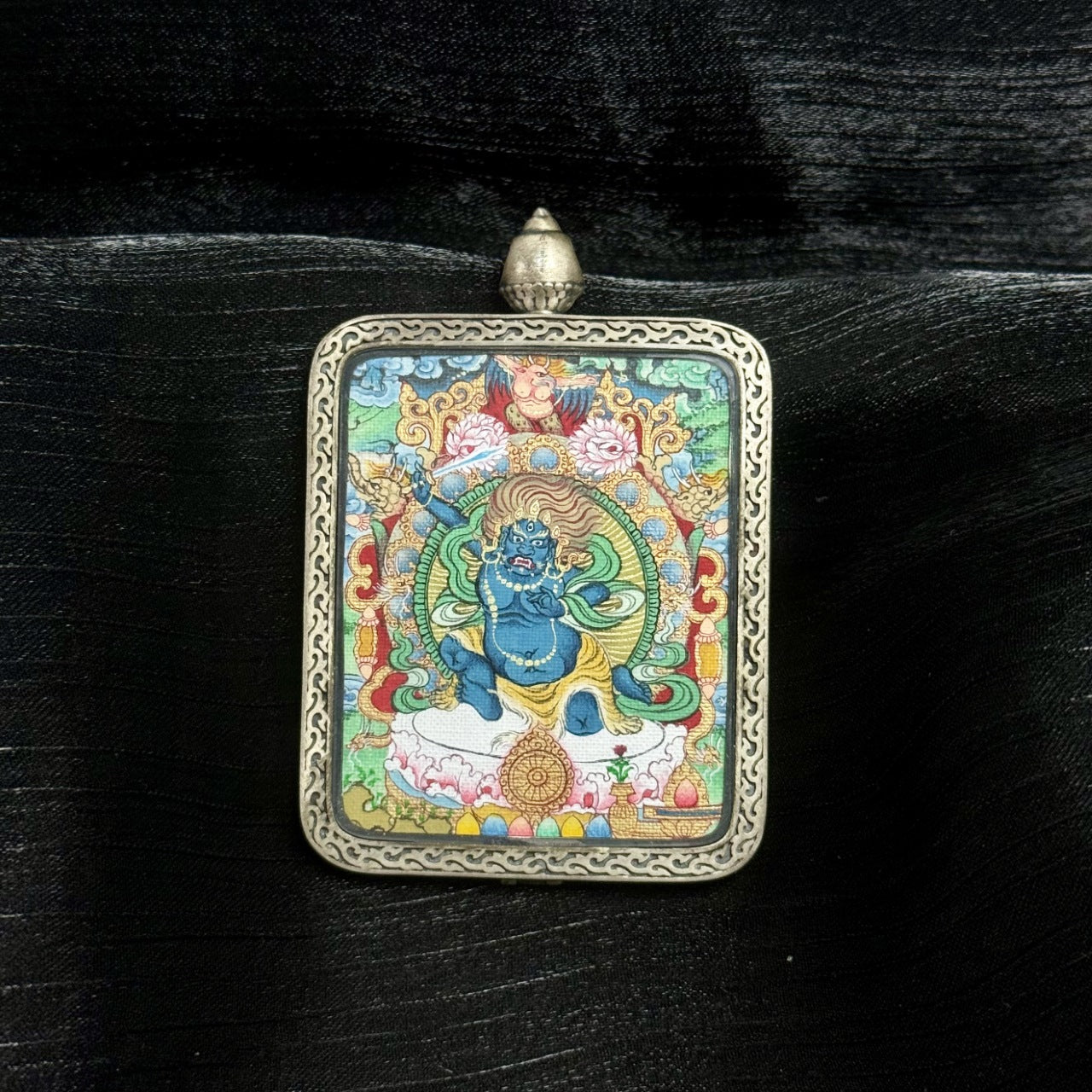 Close-up of Tibetan Acalanatha mini thangka showing intricate linework, swirling green aureole, lotus base, ritual attributes, and traditional Miansa style proportions.