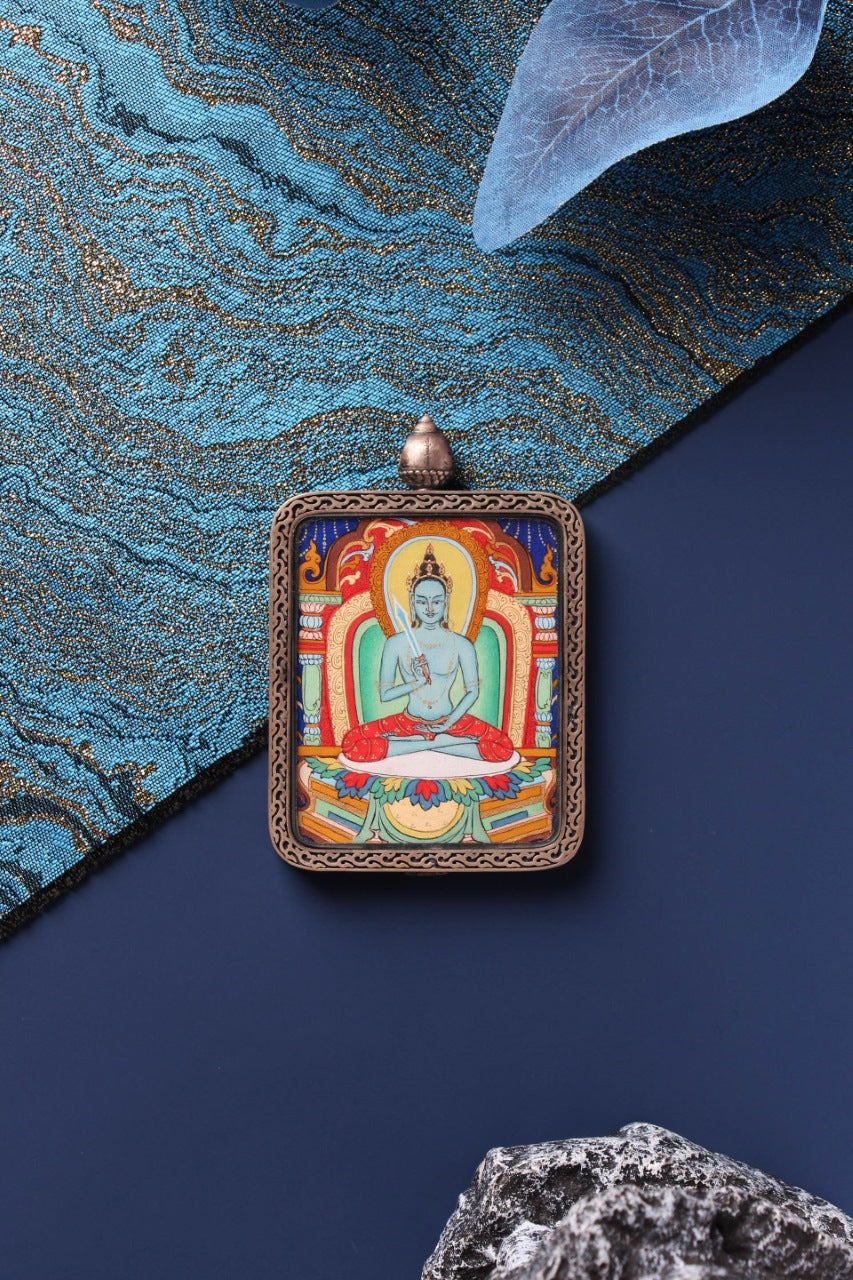 Front view of Akashagarbha Bodhisattva mini thangka pendant with detailed silver frame and colorful thangka painting