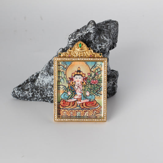 Front view of an Akashagarbha Bodhisattva mini Thangka pendant, featuring a light-toned Nepal-style painting framed in a gold-tone, jewel-embellished titanium steel case.