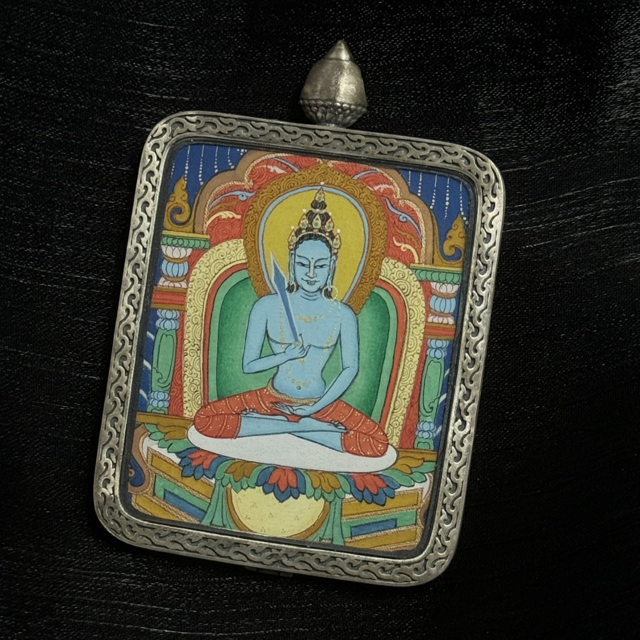 Close-up of Akashagarbha Bodhisattva Tibetan mini thangka pendant, hand-painted Buddhist devotional artwork