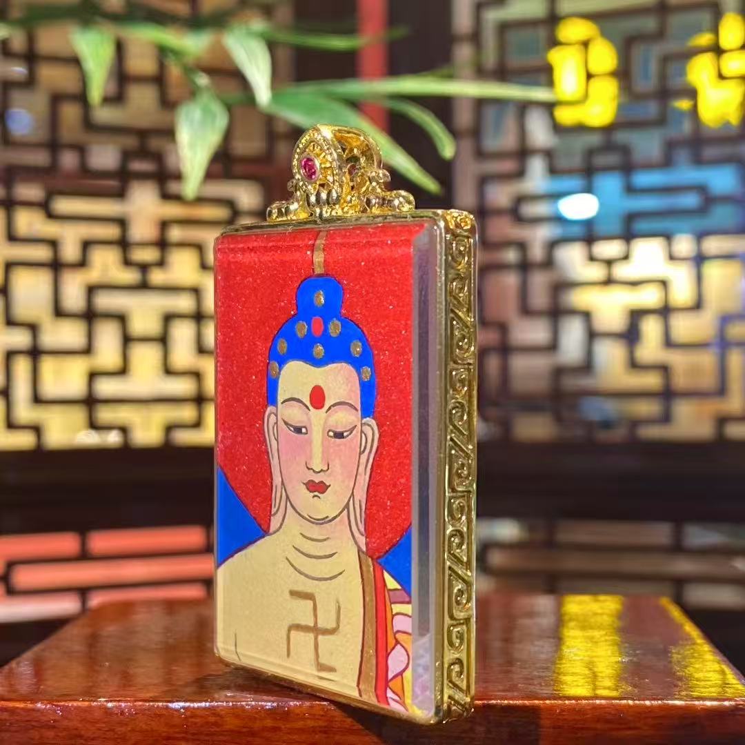 Side view of Amitabha Buddha Gau pendant highlighting the gold-plated copper frame, gemstone accents, and finely detailed craftsmanship