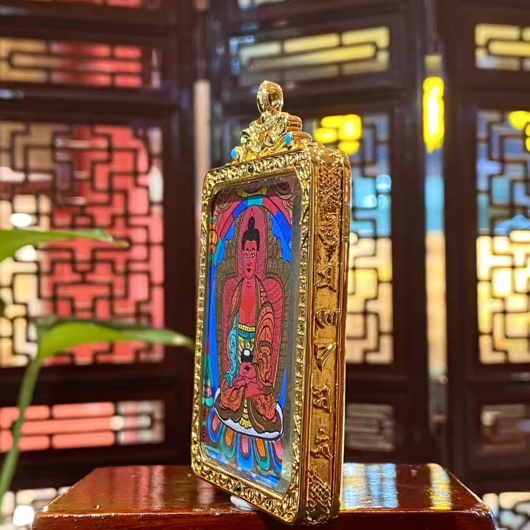 Side view of Amitabha Buddha Gau pendant highlighting the gold-plated copper frame, gemstone accents, and fine craftsmanship details