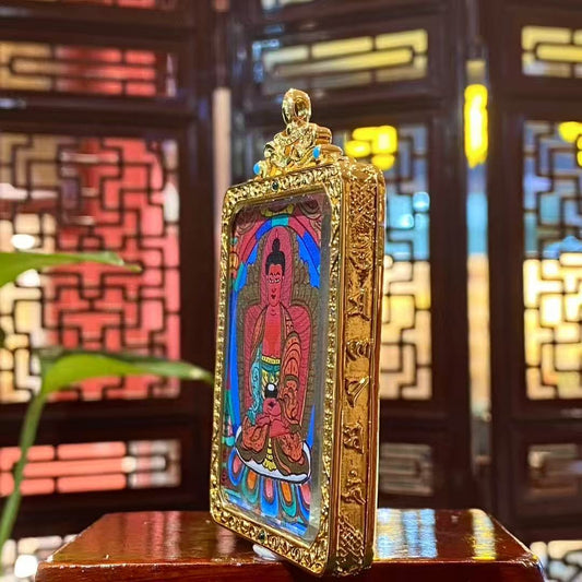 Side view of Amitabha Buddha Gau pendant highlighting the gold-plated copper frame, gemstone accents, and fine craftsmanship details