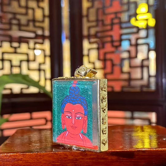 Side view of Amitabha Buddha mini thangka Gau pendant showing the gold-plated copper frame and fine handcrafted details