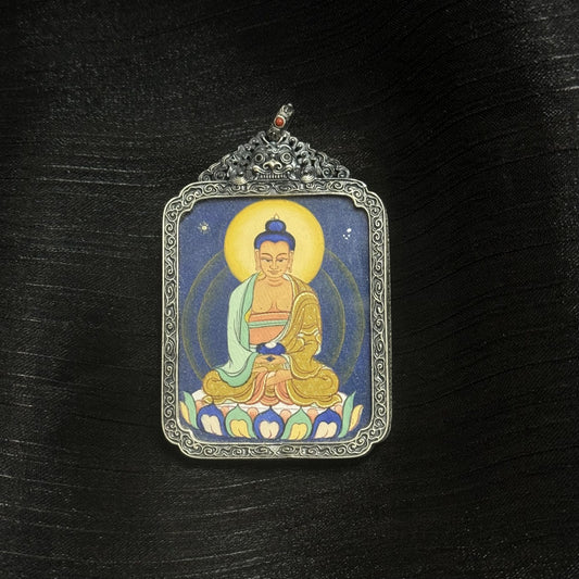 Front view of Amitabha Buddha mini thangka pendant, fully hand-painted with natural mineral pigments, set in a vintage-style silver case, Tibetan origin.