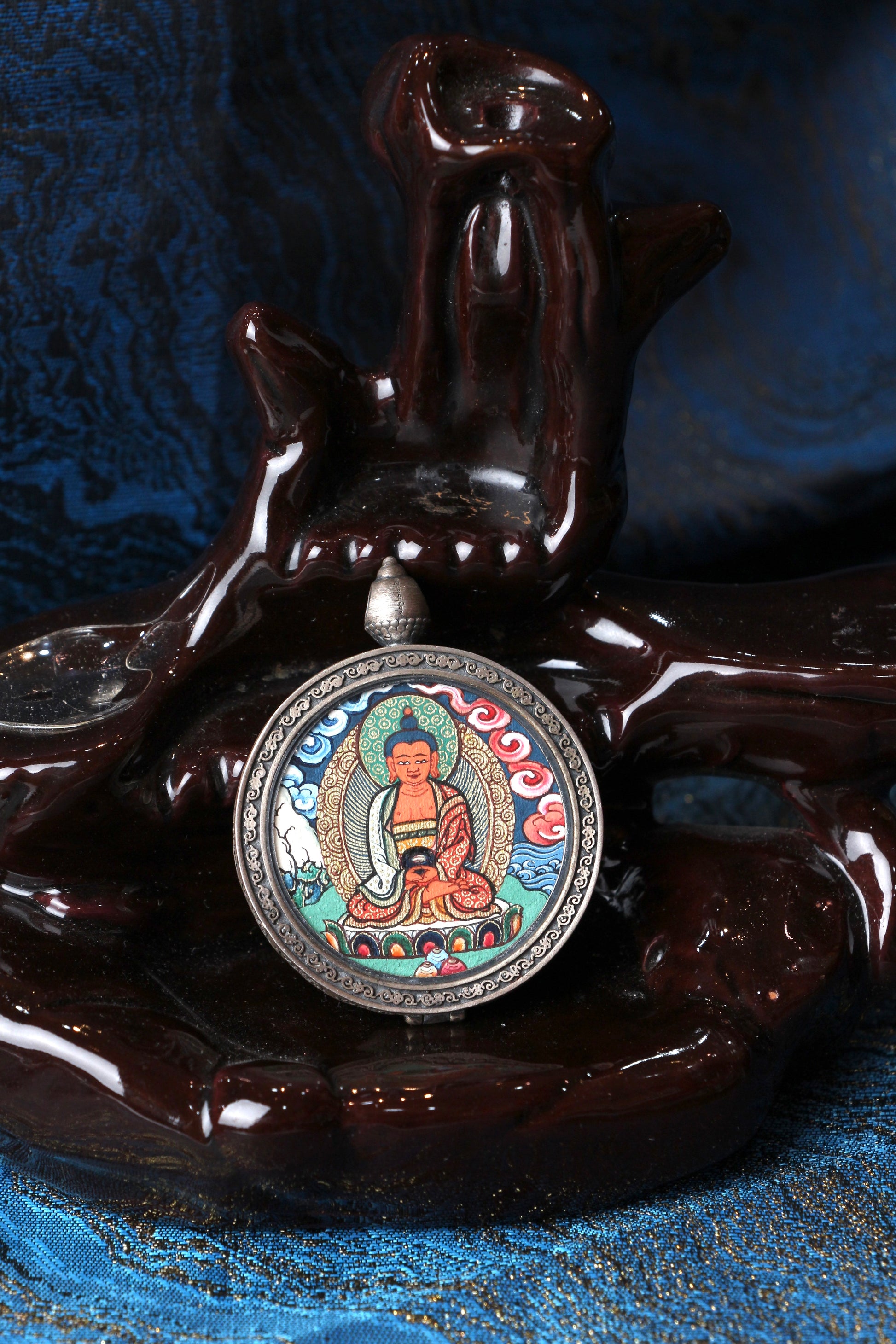 Front view of Amitabha Buddha mini Thangka pendant, hand-painted in Rebgong style with mineral pigments, set in a 925 sterling silver case