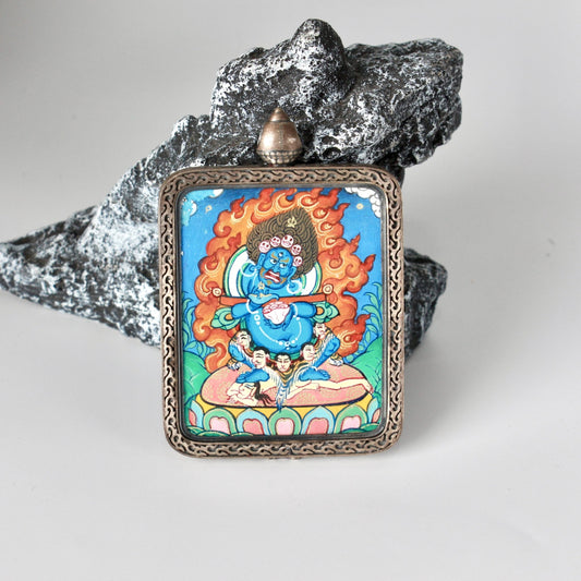 Front view of Bernagchen Black Cloaked Mahakala mini thangka pendant, fully hand-painted with mineral pigments, mounted in a Dunhuang Nine-Color Deer silver case, Rebgong thangka artwork