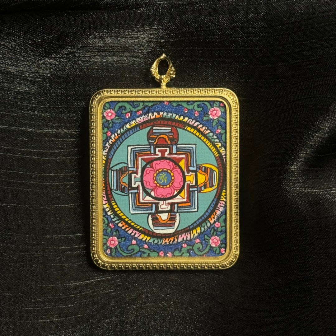 Detailed front view of mandala mini thangka pendant highlighting layered mineral pigment colors and sacred Buddhist geometric composition