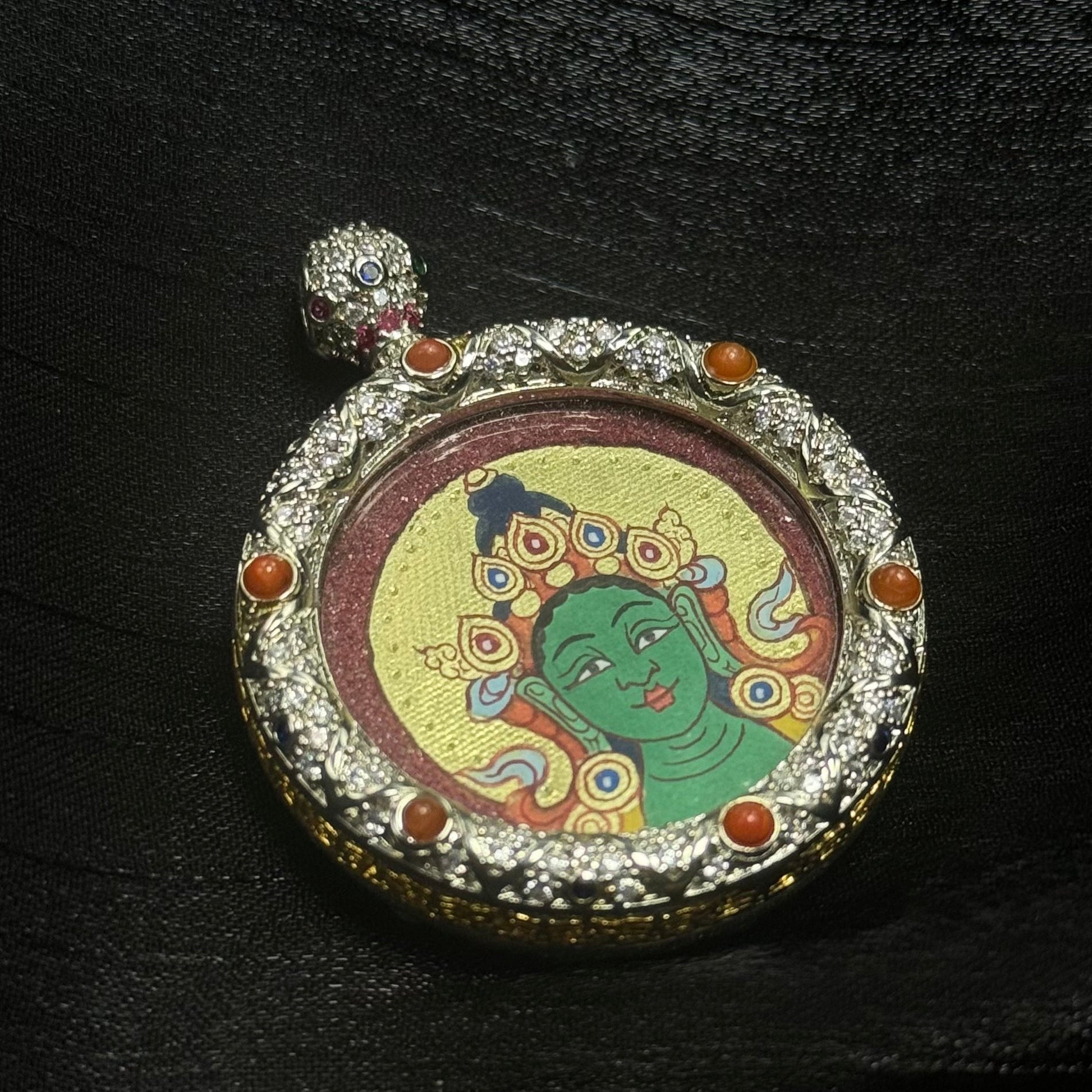 Back view of a double-sided Green Tara thangka pendant with a customizable reverse side, housed in an elegant jewelry-grade copper case