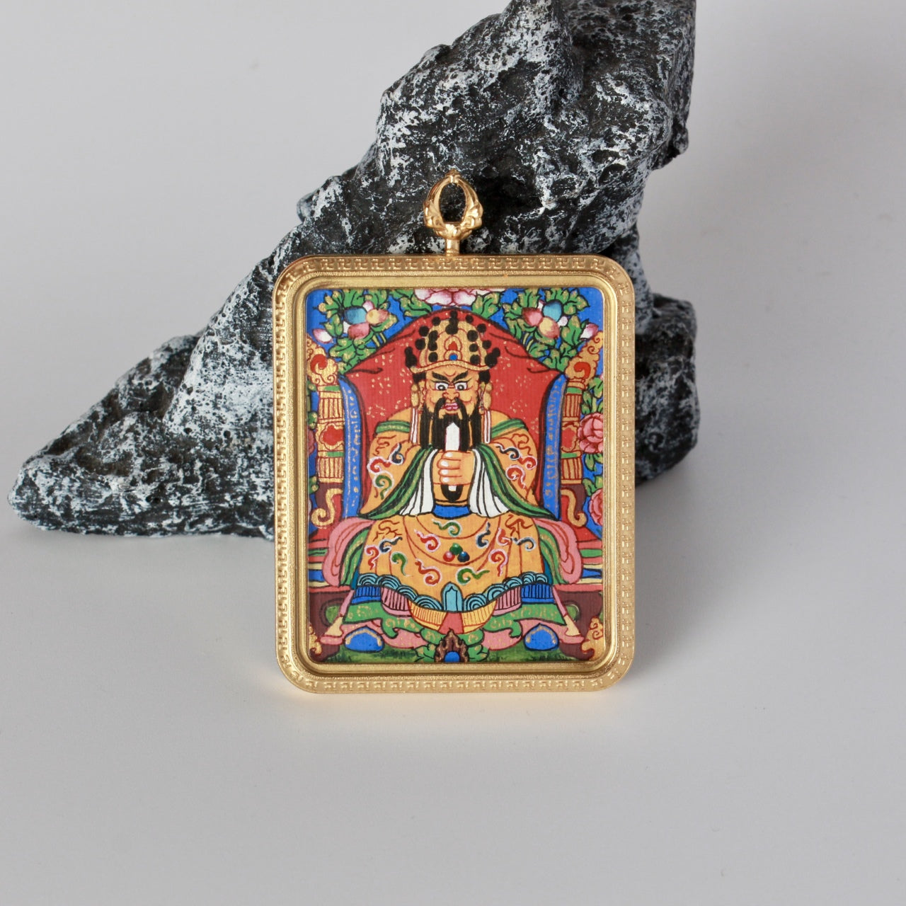 Centered front view of Dragon Fifth Lord (Long Wuye) mini thangka pendant showing the hand-painted seated figure, colorful floral background, and rectangular gold-tone titanium steel case.