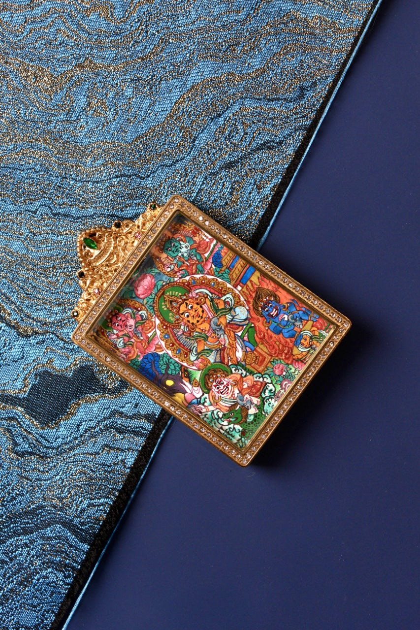Full front flat lay of Five Wealth Deities mini thangka pendant, colorful hand-painted Buddhist art under a jeweled titanium steel case, Nepal series