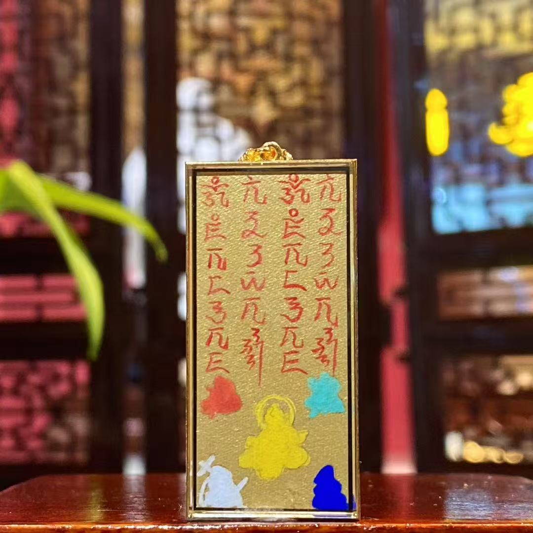 Back view of thangka pendant featuring Five Wealth Deities and traditional wealth mantras, double-sided 18K gold hand-painted Rebgong thangka