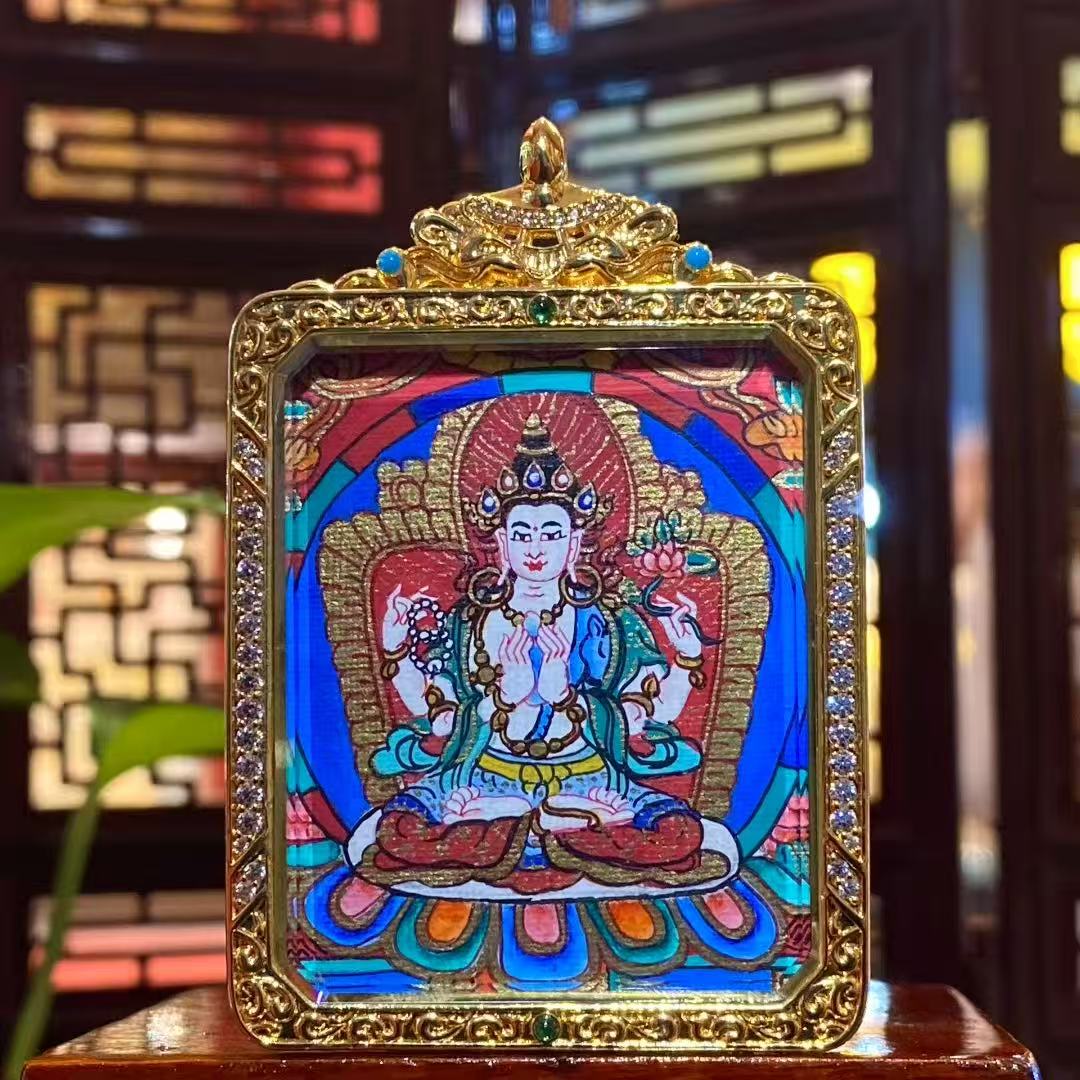 Hand-painted Four-Armed Avalokiteshvara double-sided thangka pendant in a gilded copper Ghau box, front view