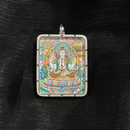 Close-up front view of the Four-Armed Avalokiteshvara mini thangka pendant, showing detailed hand-painted Avalokiteshvara with lotus throne, floral background, and traditional Tibetan iconographic elements inside a 925 silver pendant frame.