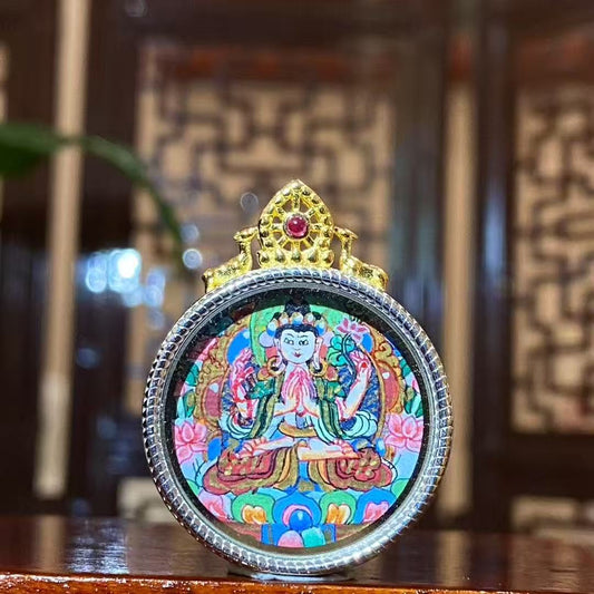 Hand-painted Four-Armed Avalokiteshvara mini thangka pendant in a 925 sterling silver Ghau box, front view