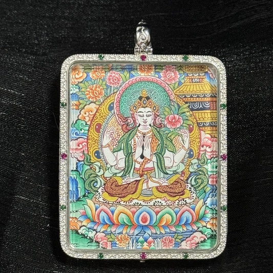 Front view of a hand-painted Four-Armed Avalokiteshvara (Chenrezig) mini thangka pendant, created in traditional Tibetan style with natural mineral pigments, double-sided artwork set in 925 sterling silver, painting size 4 × 5 cm