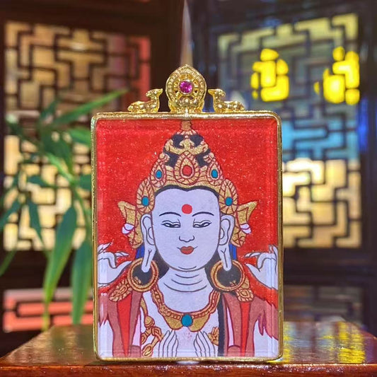 Hand-painted Four-Armed Avalokiteshvara thangka pendant in a small gilded copper Ghau box, front view