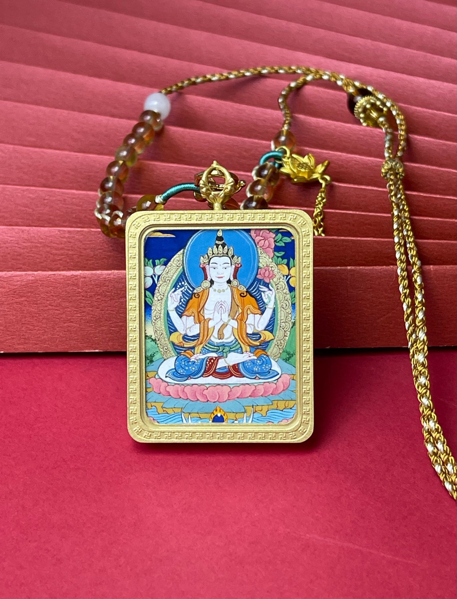 Four-Armed Avalokiteshvara Tibetan Thangka pendant paired with handwoven cord and yellow crystal beads