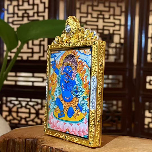 Side view of Acala Vidyaraja Tibetan thangka Gawu pendant crafted in gilded copper, showing solid structure and ritual pendant design