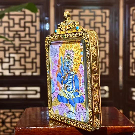 Side view of a double-sided Acala Vidyaraja Tibetan thangka Gawu pendant in a gilded copper Gawu box, showing its refined portable shrine structure