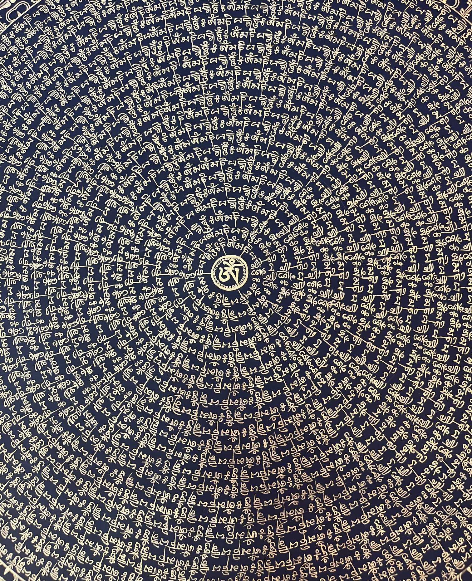 Detailed section of Om Mani Padme Hum mantra thangka featuring gold Tibetan script radiating from the central sacred syllable on a dark background.