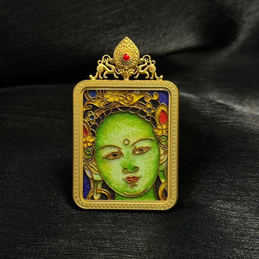 Front view of Green Tara mini thangka pendant featuring cloisonné enamel artwork with green face detail, gold-plated copper frame, and ornamental top design.
