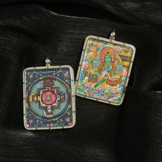 Front and back view of a Green Tara mini thangka pendant showing the hand-painted Green Tara deity and a detailed Tibetan mandala design on the reverse side inside a decorative pendant frame.