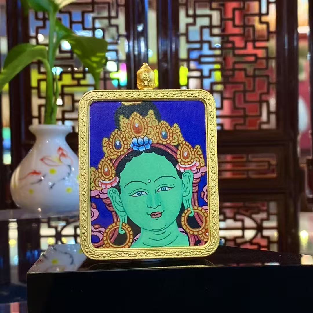 Front view of a hand-painted Green Tara Gau Thangka pendant featuring a serene Green Tara portrait set in a gold-plated copper gau box