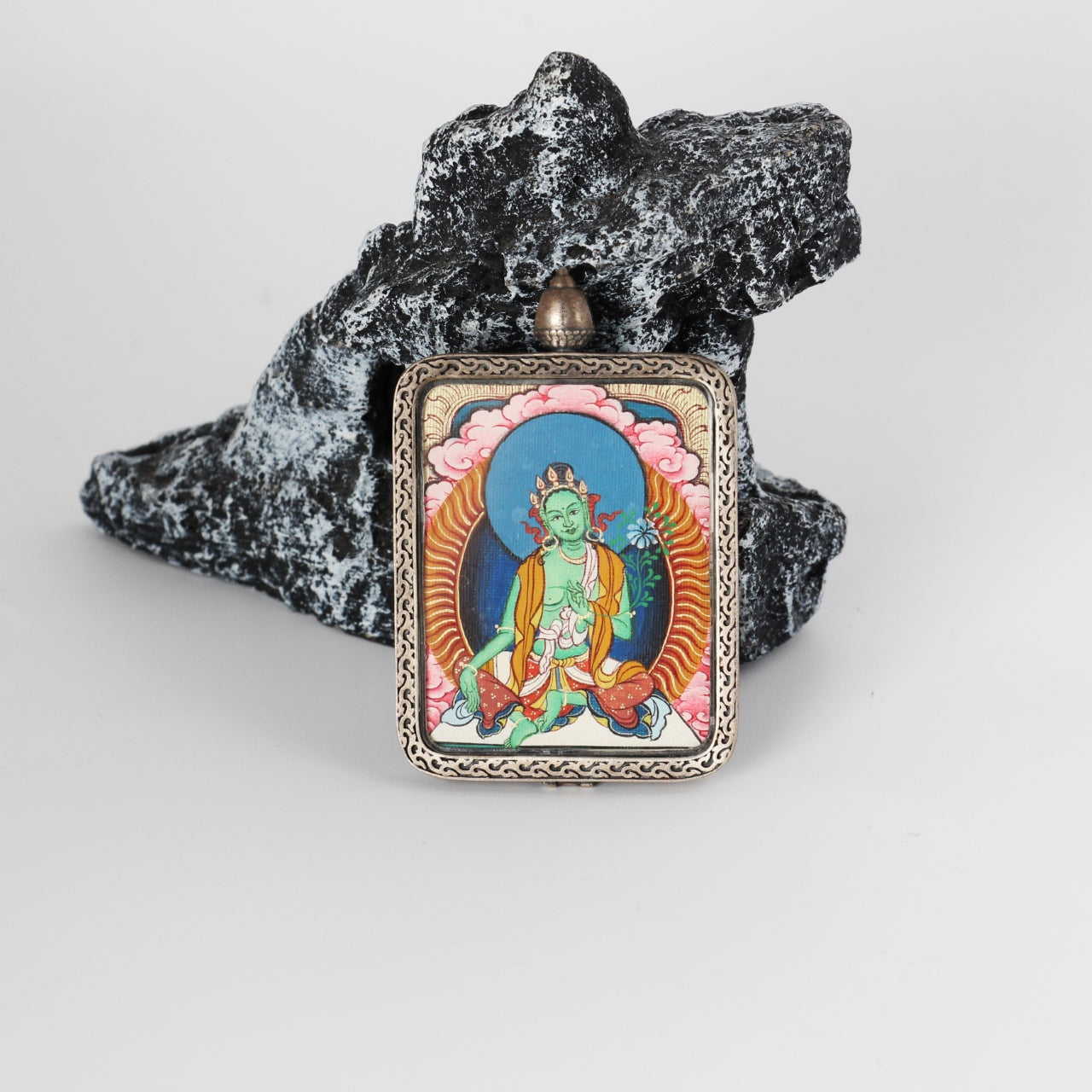 Front view of Green Tara mini thangka pendant from the Red Cloud Series, hand-painted with mineral pigments and set in a Dunhuang Nine-Colored Deer silver case