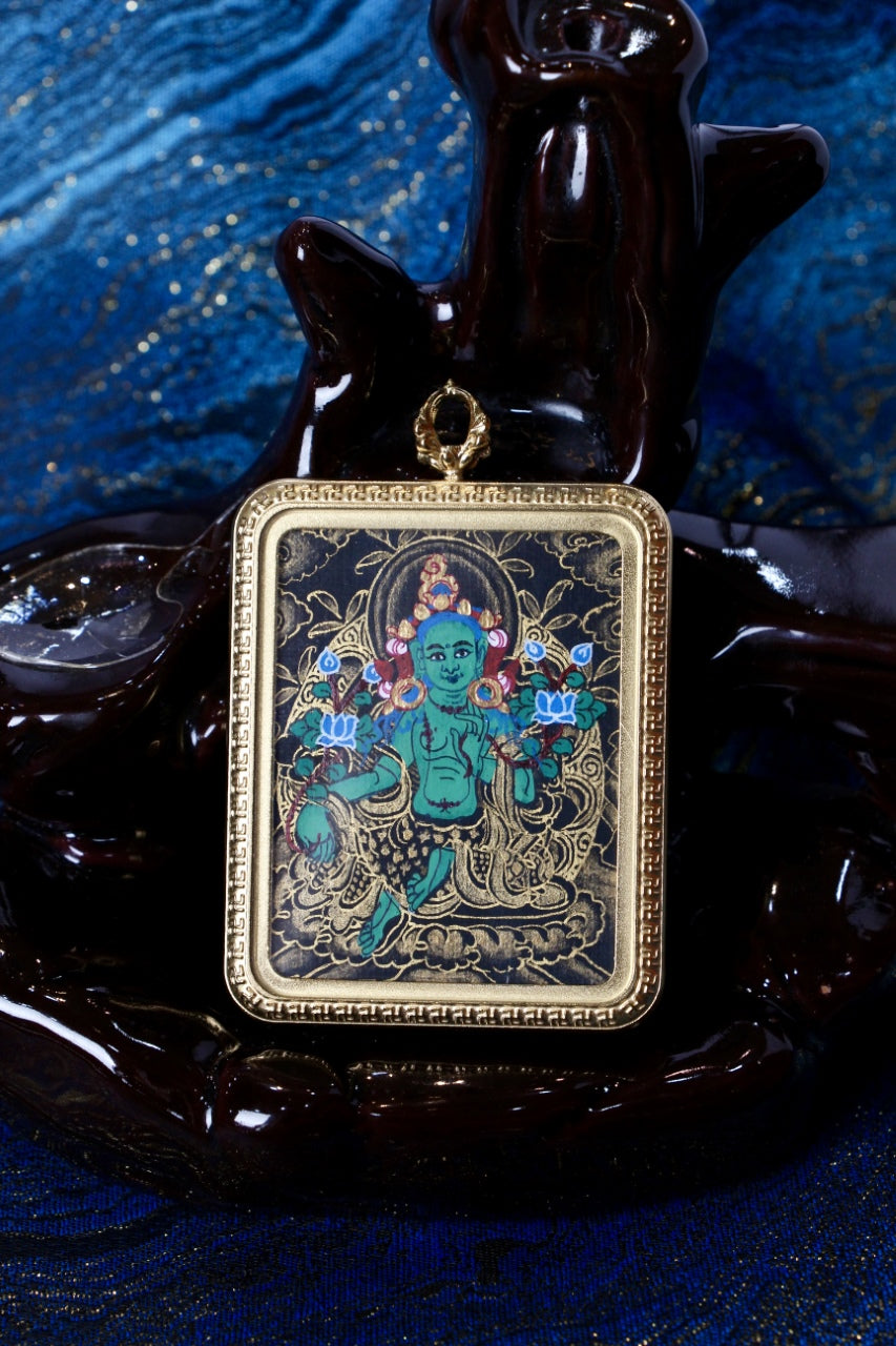 Front view of Green Tara mini thangka pendant in Nepalese black-gold style, hand-painted artwork set in a gold-tone titanium steel protective case