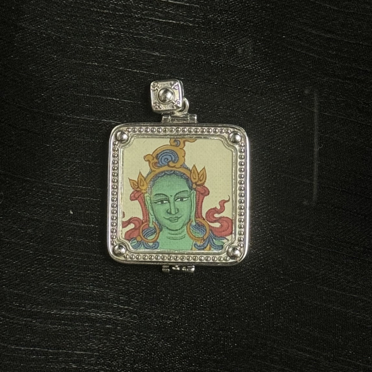 Square Green Tara pendant with hand-painted Tibetan Buddha head artwork, framed in a 925 silver-plated amulet case.