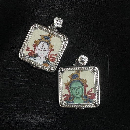 Two square Tibetan amulet pendants featuring Green Tara and White Tara hand-painted miniature art in 925 silver-plated settings.