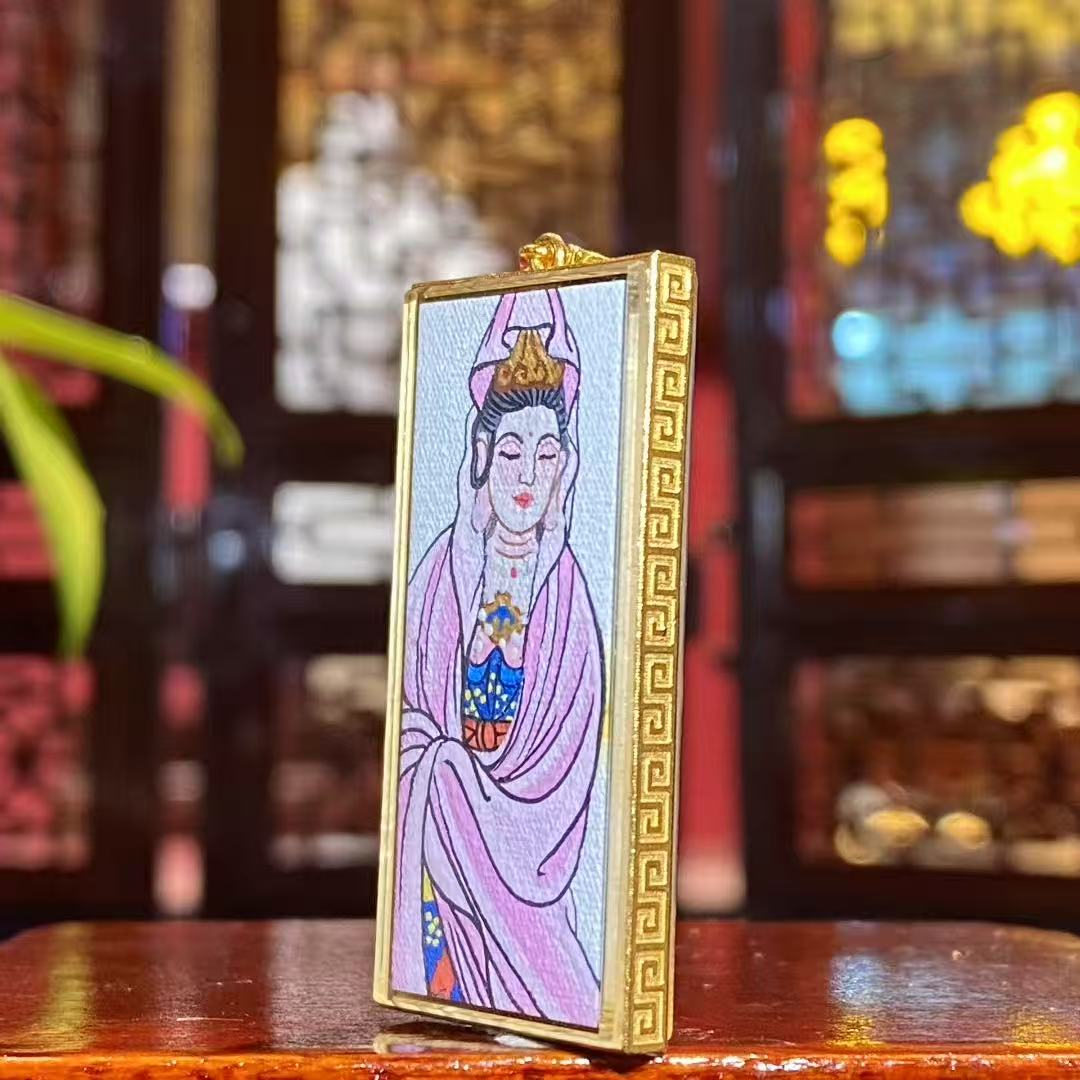 Side view of Guanyin Thangka pendant showing 18K gold Gawu box design and sapphire crystal scratch-resistant lens