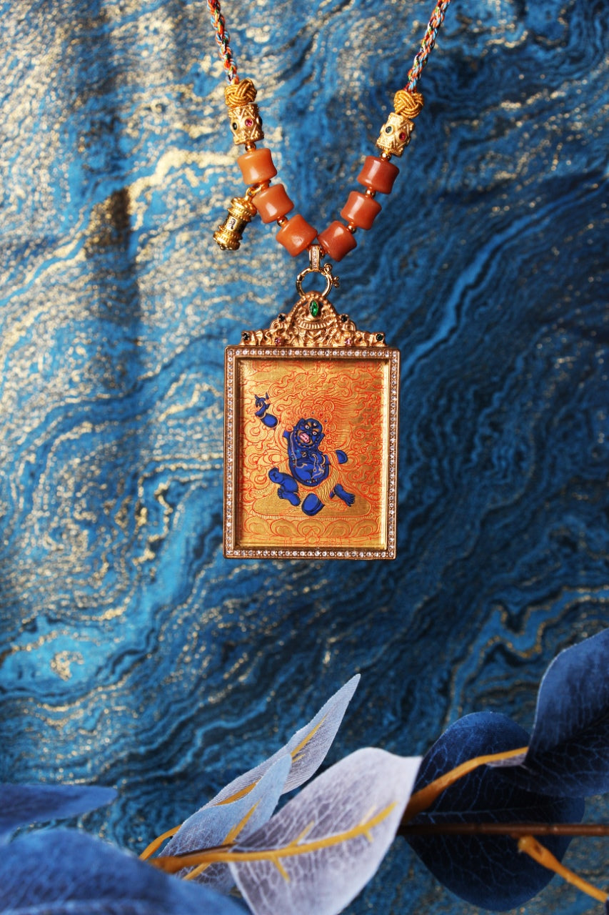Full display of hand-painted Acalanatha mini thangka pendant in Rebgong gold thangka tradition, highlighting iconographic proportions, mineral pigment texture, and double-sided titanium steel casing