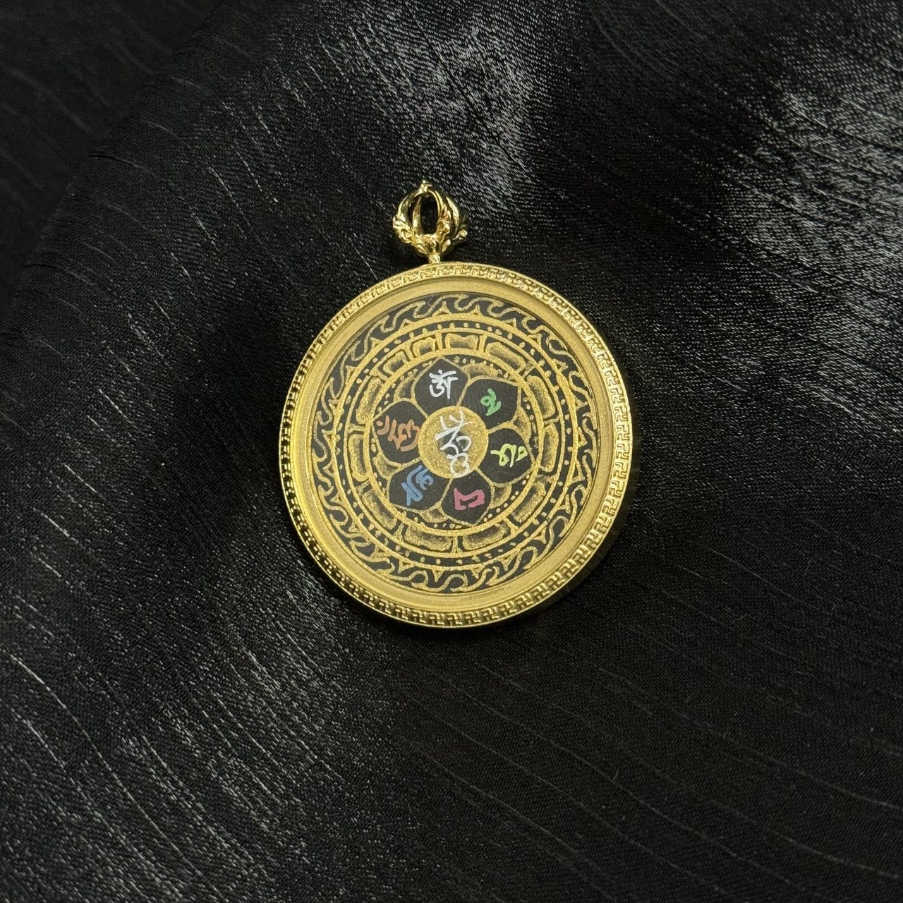 Close-up detail of Om Mani Padme Hum mantra painted in gold powder, layered mineral pigments on lotus petals, fine hand-painted lines