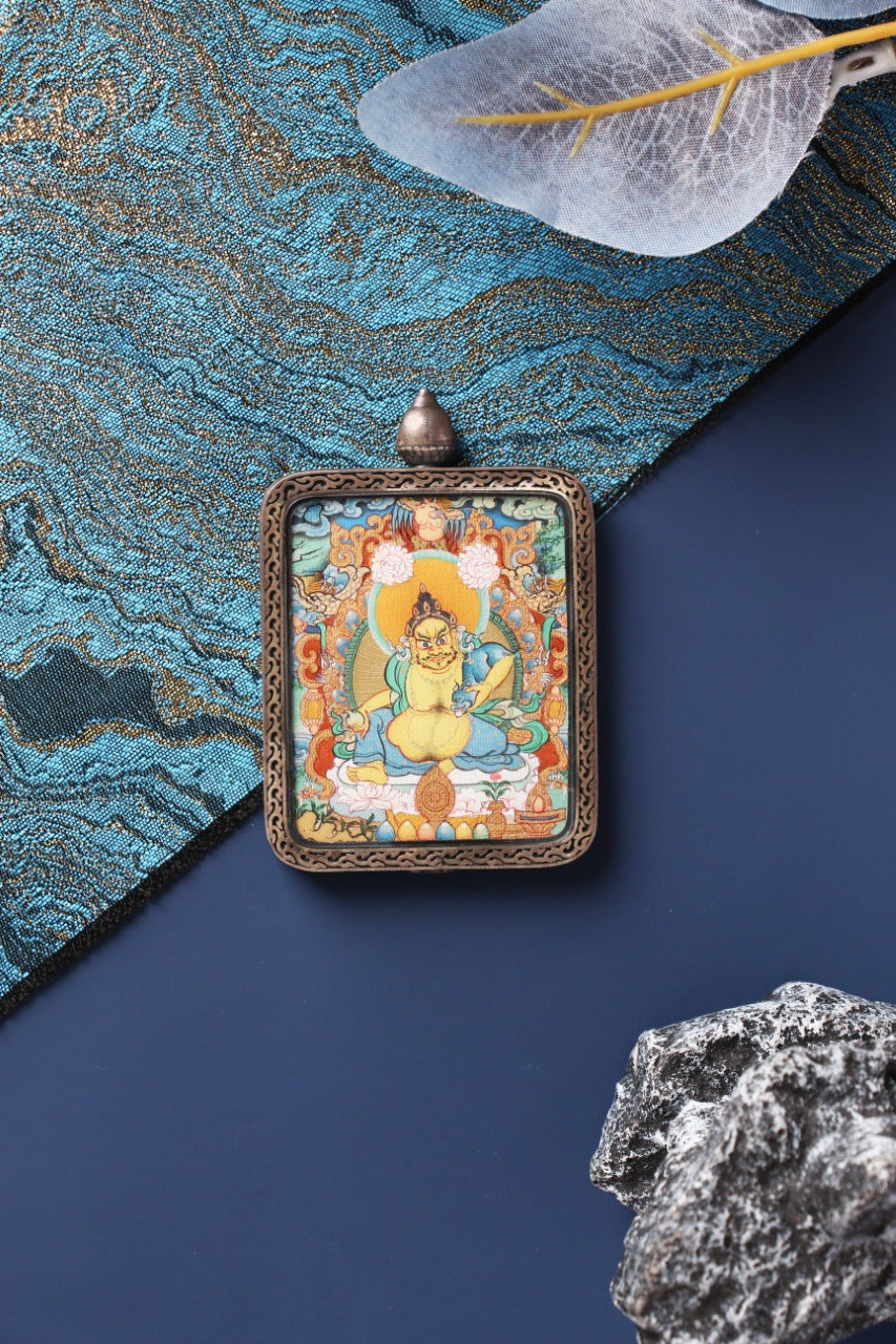 Hand-painted Yellow Jambhala thangka pendant from Tibet, Menri school style, traditional Buddhist art for wealth blessing and spiritual practice
