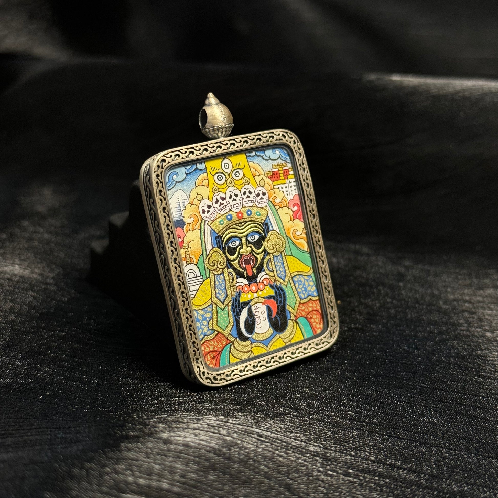 Close angled view highlighting the expressive facial features of Zaki Lhamo, fine linework, layered mineral pigments, and gold powder accents typical of Rebgong thangka painting.