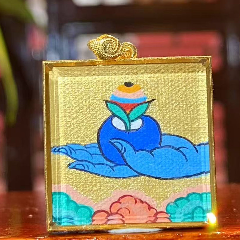 Back view of double-sided Tibetan mini thangka pendant featuring symbolic healing vessel associated with Medicine Buddha