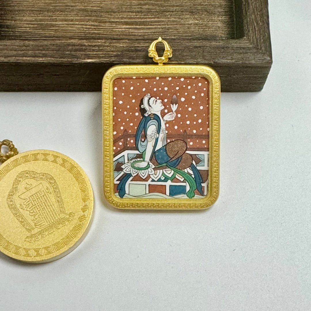 Front view of a hand-painted Holding Lotus Avalokiteshvara mini thangka pendant, featuring mineral pigment painting set in a matte copper frame with fine decorative border.