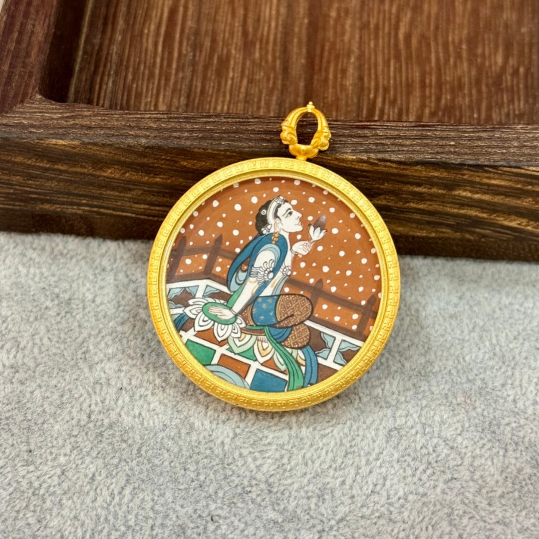 Upright display of a Holding Lotus Avalokiteshvara mini thangka pendant, highlighting fine line work, layered mineral pigments, and Dunhuang-inspired composition.