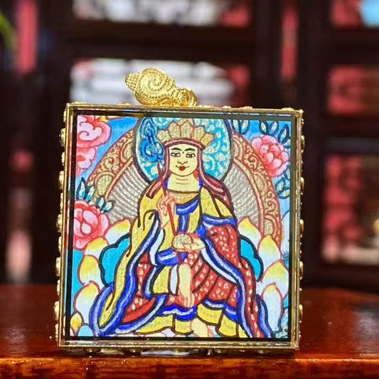 Front view of a Kṣitigarbha Bodhisattva Thangka pendant holding a Khakkhara, double-sided and fully hand-painted in 18K gold using Rebgong craftsmanship