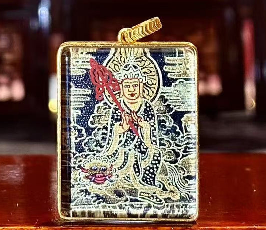 Front view of a Kṣitigarbha Bodhisattva and Diting Black Gold Thangka pendant, double-sided and hand-painted in 18K gold using Rebgong Nag Thangka craftsmanship